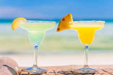 Two tasty cocktails on tropical white beach