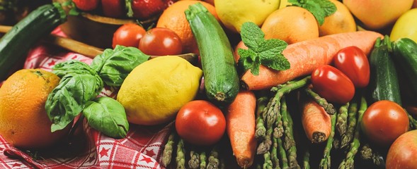 shapes and colors of fruit and vegetables arranged in a rustic composition