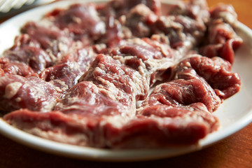 Fresh raw meat on plate 