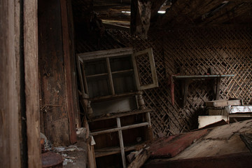 Fototapeta na wymiar The interior of an old abandoned village house - a large wooden sideboard