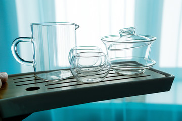 empty glassware for tea bowls, chahai, teapot, on the tea Board.