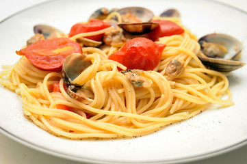 spaghetti dish with seasoning of Piennolo tomatoes from Campania and clams