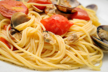 spaghetti with seasoning of Piennolo tomatoes from Campania and clams