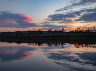 Purple sunset on the Oka River - a beautiful evening river landscape.