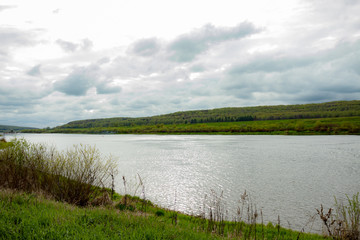 The large navigable river Oka in Russia in the spring on a sunny day, a beautiful river landscape.