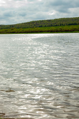 The large navigable river Oka in Russia in the spring on a sunny day, a beautiful river landscape.