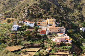 Fototapeta na wymiar Colorful homes in Vallehermoso town and valley on the island of La Gomera, Canary Islands, Spain