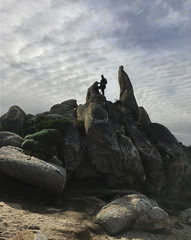 Man and environment Carmel California Rocky Promontory at Beach Winter Skies, coastal, rocky, boulders, silhouette