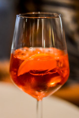 Glass of spritz cocktail close up - Spritz is a wine-based cocktail served as an aperitif in Italy.