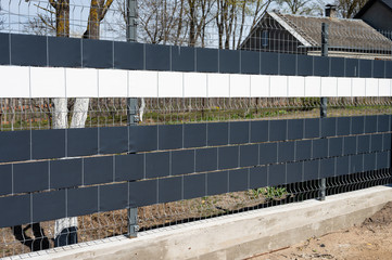 metal street fence. making a fence of metal residues