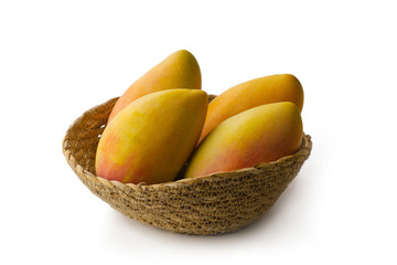 Ripe mango fruit in basket isolated white background