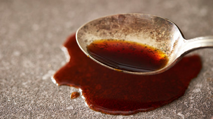 Soy sauce with rusty spoon
