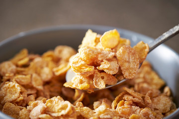 Corn flake and milk eating with spoon