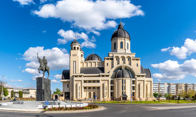The statue of Stefan Cel Mare and  Cathedral in center of Bacau city, Moldavia landmark, Romania