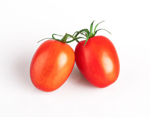 cherry tomatoes on a branch isolated on a white background