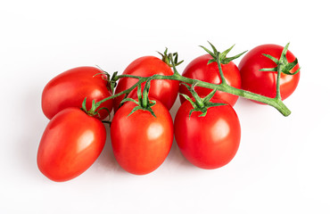 cherry tomatoes on a branch isolated on a white background