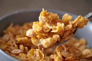 Corn flake and milk eating with spoon