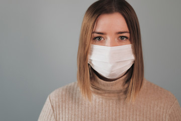 Portrait of One Beautiful Girl in White Medical Mask