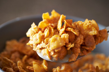Corn flake and milk eating with spoon