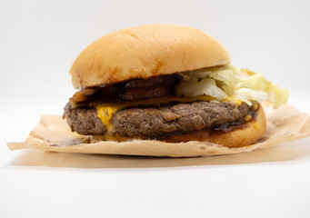 Closeup of big beef hamburger with vegetable and ketchup