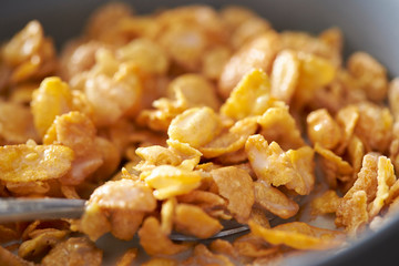 Corn flake and milk eating with spoon