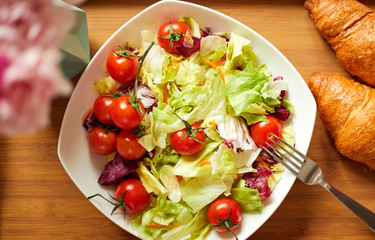 Healthy vegetable salad of fresh tomato and lettuce.