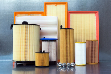 Car spare parts close-up on a steel background. Car filters.