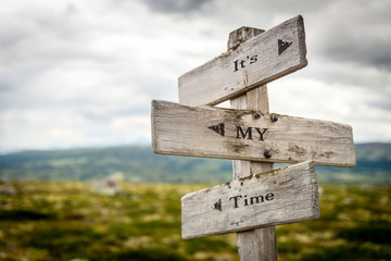 its my time text engraved on old wooden signpost outdoors in nature. Quotes, words and illustration concept. - obrazy, fototapety, plakaty