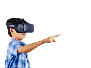 Boy wearing virtual reality glasses in modern interior design studio and pointing to something appear in VR with exciting.Isolate background concept.Have clipping path.