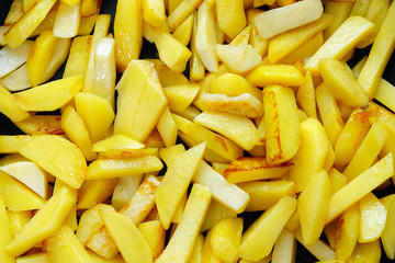 cooking fried, raw potatoes background texture
