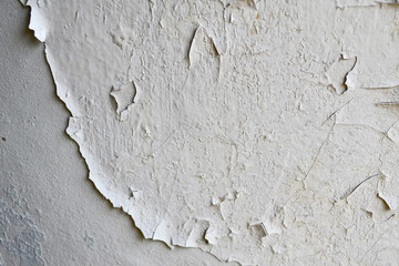 White peeling paint on the wall seamless texture. Background
