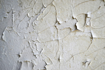 White peeling paint on the wall seamless texture. Background