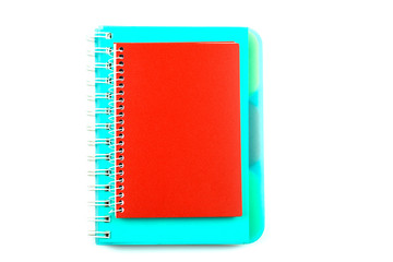 Blue and red notebooks isolated on a white background.