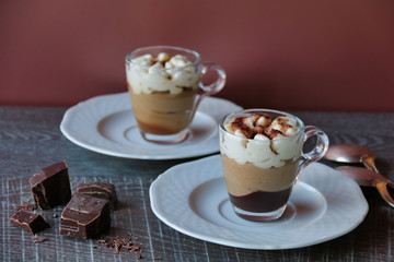 two cups of coffee cream with whipped cream