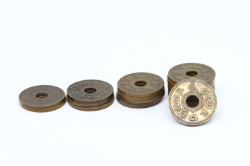 Close-up old Thailand coin on white background.