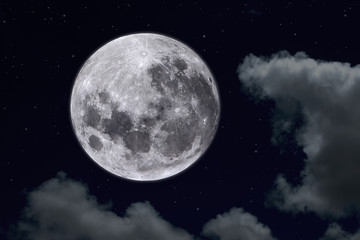 Fototapeta na wymiar Full moon with white clouds in the dark night.
