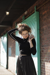 Retro young woman at the train station