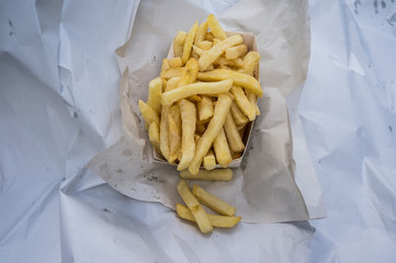 french fries on a white paper plate