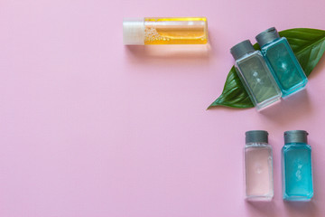 Spa cosmetics set. Copyspace for text. Flatlay on pink background.