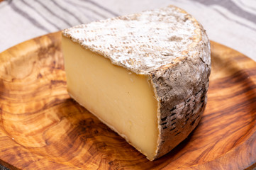 Cheese tomme de montagne or tomme de savoie made from cow milk in French Alps.