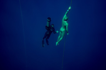 scuba diver in the deep blue sea
