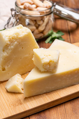 Pieces of matured pecorino romano italian cheese made from sheep milk in Lazio, Sardinia or Tuscany