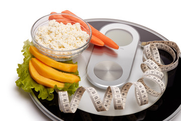 Healthy food concept. Slimming. Scales, measuring tape and healthy meal. Control of weight during the isolation period