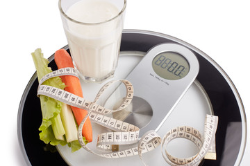 Healthy food concept. Slimming. Scales, measuring tape and healthy meal. Control of weight during the isolation period