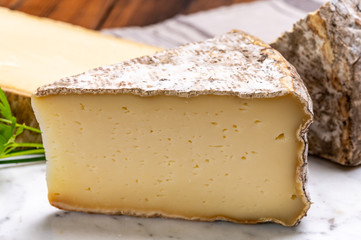 Cheese tomme de montagne or tomme de savoie made from cow milk in French Alps.