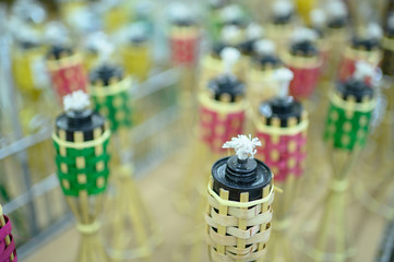A traditional Bamboo lamp or pelita buluh over white backgrounds