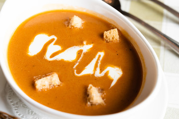 Lopster soup with crouton on a table