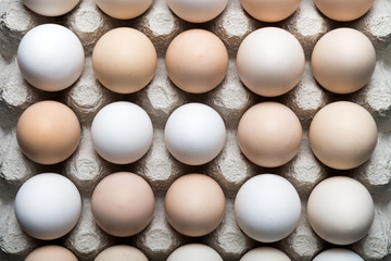Chicken eggs in organic packaging closeup. Healthy eating background. Food photography