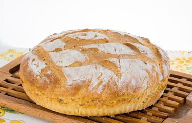 Freshly baked homemade bread on bread board.