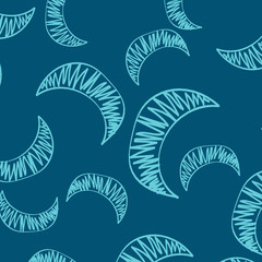 Obraz premium The seamless pattern of manually drawn crescents. The blue crescent is chaotically scattered across the blue field to form a beautiful pattern for children's room wallpaper or wrapping paper.